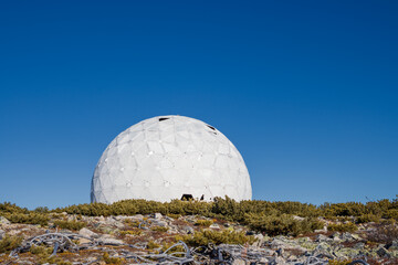 Abandoned dome of an old Soviet military radar from the Cold War. A huge structure in the form of a...