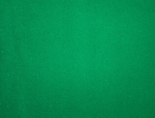 Green felt fabric close-up. Abstract background. The texture of the fibers. Velvet surface.