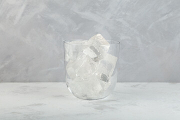 Ice cubes in clear glass for cocktail or summer refreshing drink.  Design element