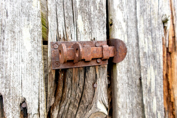 Old wooden door closed with cramps.