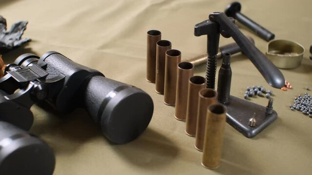 shotgun cartridges reloading. capsules, shells, powder, cartridges, scales on the table