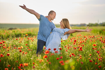 Mixed race couple in the poppy field