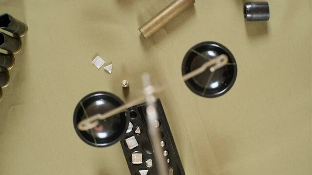 shotgun cartridges reloading. capsules, shells, powder, cartridges, scales on the table