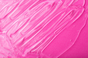 Top view of liquid cosmetics gel with bubbly structure on pink background.Good as cosmetic mockup.