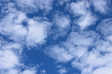Blue sky with fluffy clouds. Abstract background
