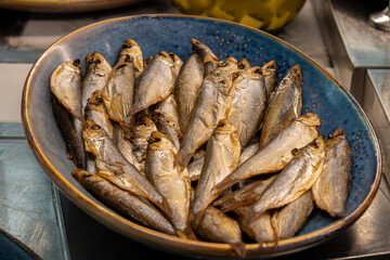 Typical Israeli breakfast buffet at any hotel. Fish buffet with many types of cold fish dishes including smoked fish. Close up of sardines. Traditional Israeli breakfast food.
