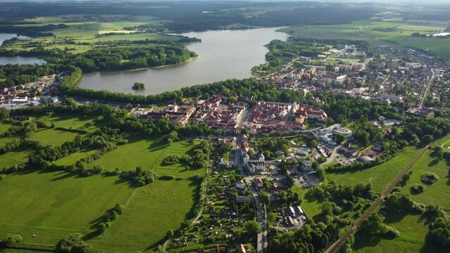 Aerial view of a small historic town of Trebon surrounded by protected landscape area with a muddy pond (famous fishing area) and rich fauna and flora. South Bohemia. Czechia. Central Europe.