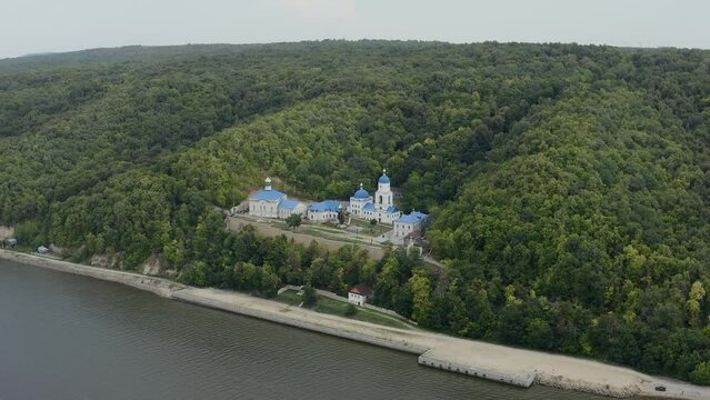 Makaryevsky men Monastery on the banks of the Sviyaga and the Volga River. Christianity and Orthodoxy. A picturesque peaceful place on the water. Forest hills. Pilgrimage and Diocese. Drone footage. 