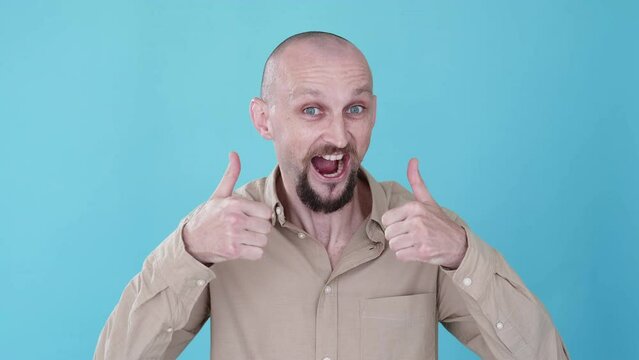 Approval sign. Like gesture. Boomerang animation. Perfect choice. Excited comic man recommending with thumbs up yeap positive reaction gif loop isolated on blue copy space background.