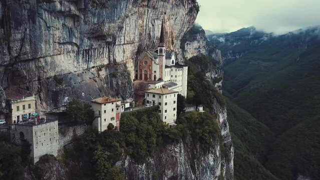 Church on the side of a cliff, Santuario Madonna Della Corona. Sacred place of fantastic beauty. The beauty of religion and nature of Italy. Northern Italy. Monte Baldo Rock. Near Verona city. 