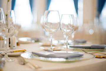 Catering services. glasses set and dishes plates in restaurant