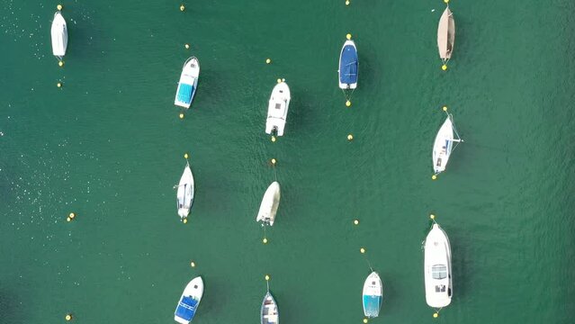 Top down aerial view of boats moored on the River Fowey, In South Cornwall, UK.