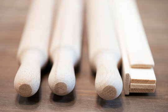 Wooden handicrafts. Rolling pins in a wooden box.