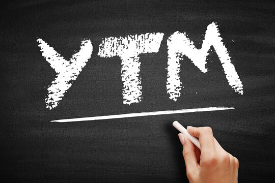 YTM - Yield To Maturity Is The Percentage Rate Of Return For A Bond Assuming That The Investor Holds The Asset Until Its Maturity Date, Acronym Text On Blackboard