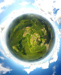 little planet style picture of lsmall village in woods  Nature background