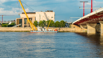 bridge over the river with construction barge in Budapest