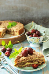 Homemade summer pastry gluten free. Chocolate and cottage cheese pie with cherries on a rustic table. Copy space.