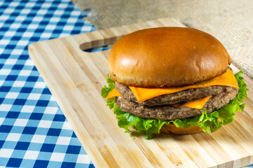 head on shot of double meat cheeseburger with salad. with copy space or text area