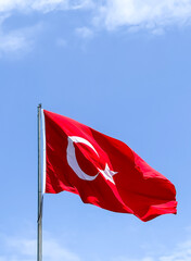 turkish flag wawing in the air or over blue sky in a sunny day in Turkey