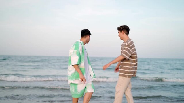 Couple gay Having Fun In The Beach