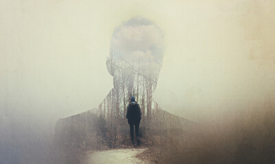 The soul seeks its own path. Composite image of a mans silhouette superimposed on a woman alone in...