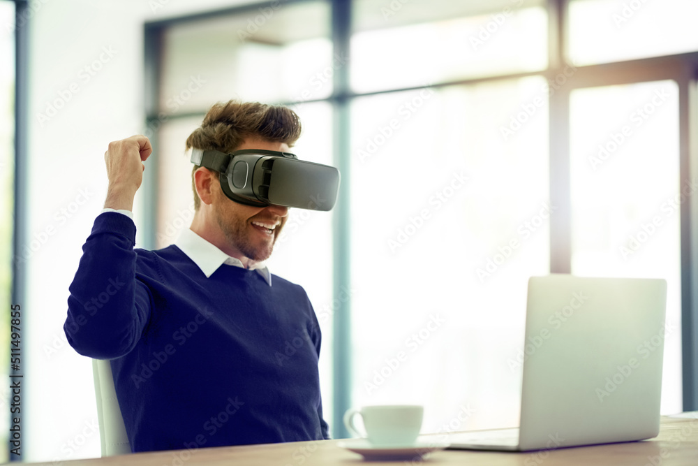 Aufkleber he just scored another win. shot of a businessman wearing a vr headset and doing a fist pump while w