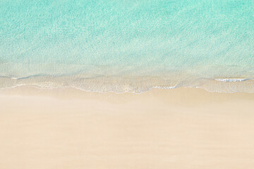 Top view of tropical Seychelles sand beach. Blue, turquoise transparent water surface of ocean, sea, lagoon. Horizontal background. Aerial, drone view