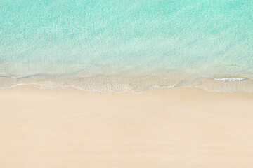 Top view of tropical Seychelles sand beach. Blue, turquoise transparent water surface of ocean,...