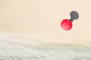 Top view of woman with red summer umbrella walking tropical Seychelles sand beach. Blue, turquoise...