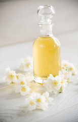 Obraz na płótnie Canvas medicinal herbal tincture with jasmine in a glass bottle