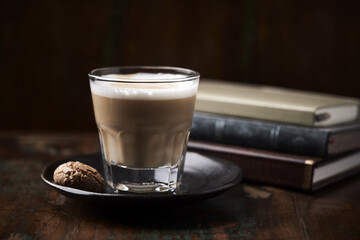 Coffee with milk on dark wooden background. Soft focus. Copy space.	