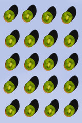 pattern of cut kiwis on a background with shadows