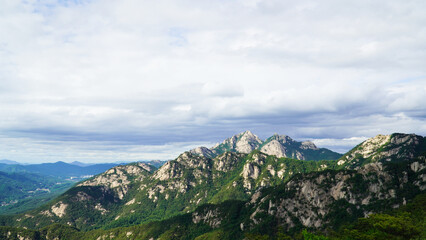 The grandeur of the mountain peaks and clouds of Bukhansan Mountain