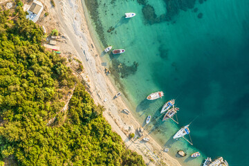 .Port, dock with boats, cruise ship, yachts in blue, turquoise sea water. Summer vacations and travel concept. Marina. Aerial, top, drone view