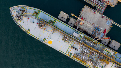 Aerial view petrochemical tanker park offshore at oil terminal commercial port for transfer crude oil to oil refinery, Global business logistic industrial crude oil and fuel tanker ship.