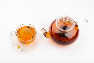 Composition with cup of jasmine tea and flowers on light background