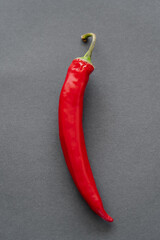 Top view of chili pepper on black background.