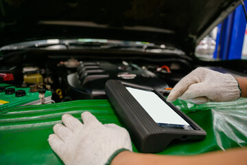 The mechanic works at the car service center. Perform a vehicle diagnostic scan using the OBD and...