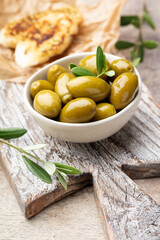 Green olives on gray background.