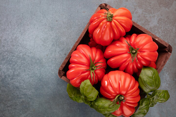 Tomatoes coeur with basil leaf,  close up.