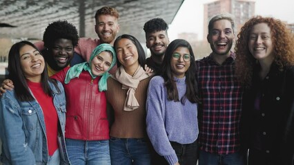 Young multi ethnic friends having fun together hanging out in the city - Friendship and diversity concept