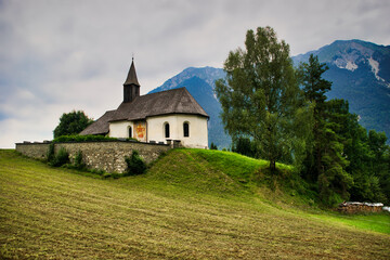 Fototapeta na wymiar Ancient church in the Austrian Alps in Summer
