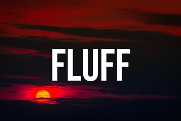 FLUFF - word on the background of the sky with clouds.