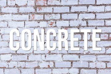 Fototapeta na wymiar CONCRETE - word on concrete background. Cement floor, wall.