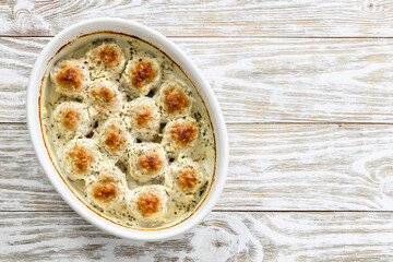 Baked Swedish meatballs in baking dish. Top view, copy space, flat lay.