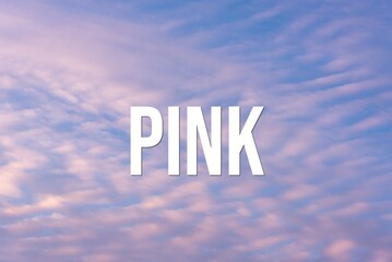 Fototapeta premium PINK - word on the background of the sky with clouds.