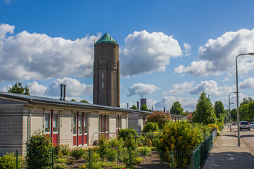 View on the city skyline of Oss, the Netherlands from "Old Churchstreet". With in the back a watertower, build in 1935. Further back the neogothic Big Church.