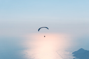 Naklejka na ściany i meble Paraglider flying on Oludeniz beach in Fethiye, Mugla,. Travel destination. Summer and holiday concept.