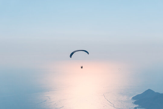 Paraglider flying on Oludeniz beach in Fethiye, Mugla,. Travel destination. Summer and holiday concept.