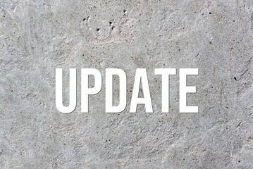 UPDATE - word on concrete background. Cement floor, wall.